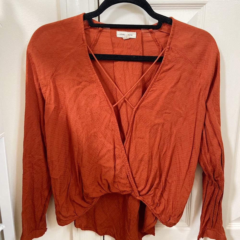 Orange long sleeve top with cross detailing